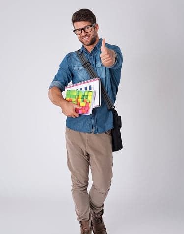 A tutor holding course notes, ready to teach