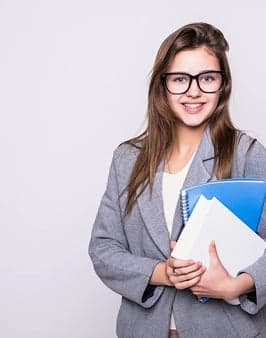 A student holding notebooks